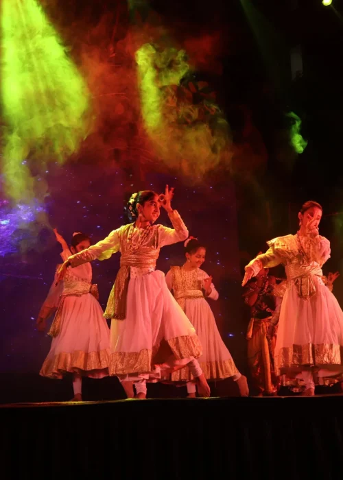 Students Performing Classical Dance on Stage